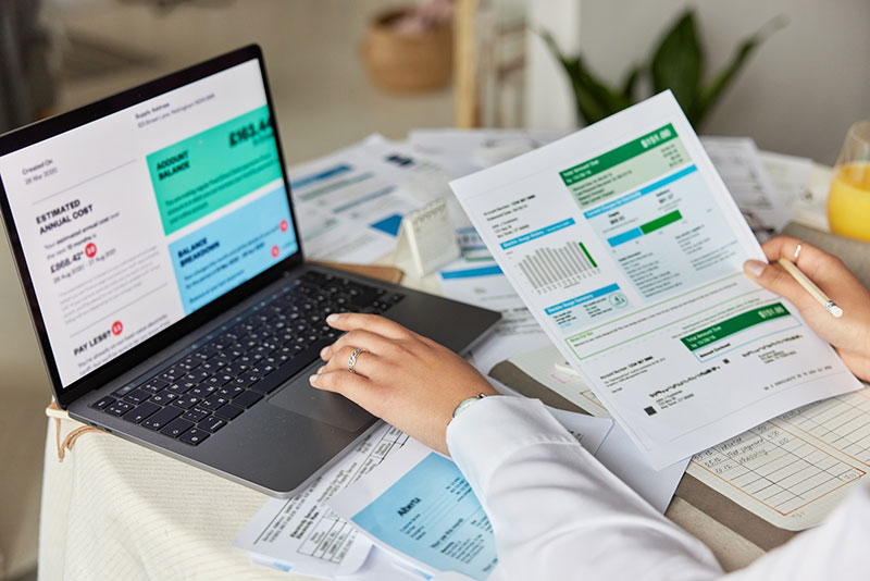 Paying bills on a laptop
